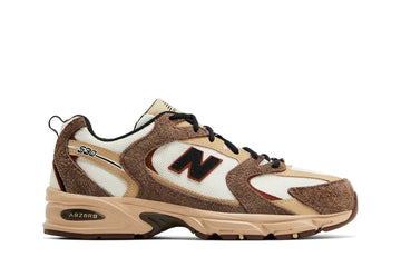 Tênis New Balance 530 Brown Tan Marrom vista lateral